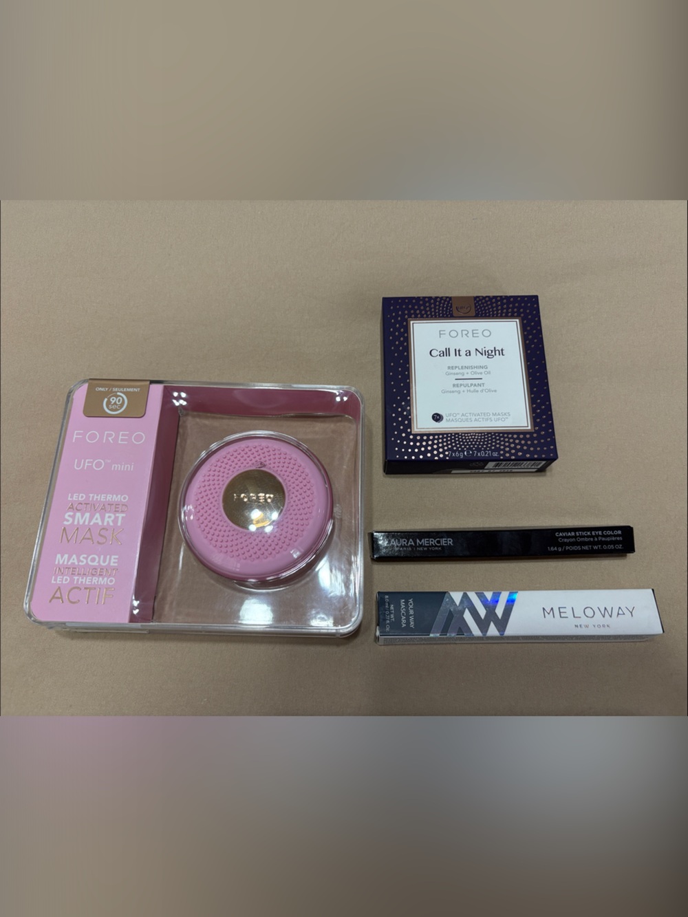 FOREO pink UFO mini LED facial device with gold accent